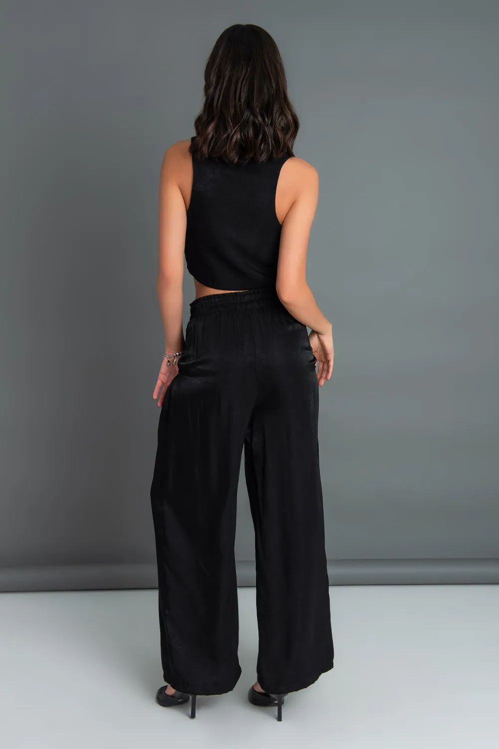 Pantalón fluido fit wide leg cintura alta elástica