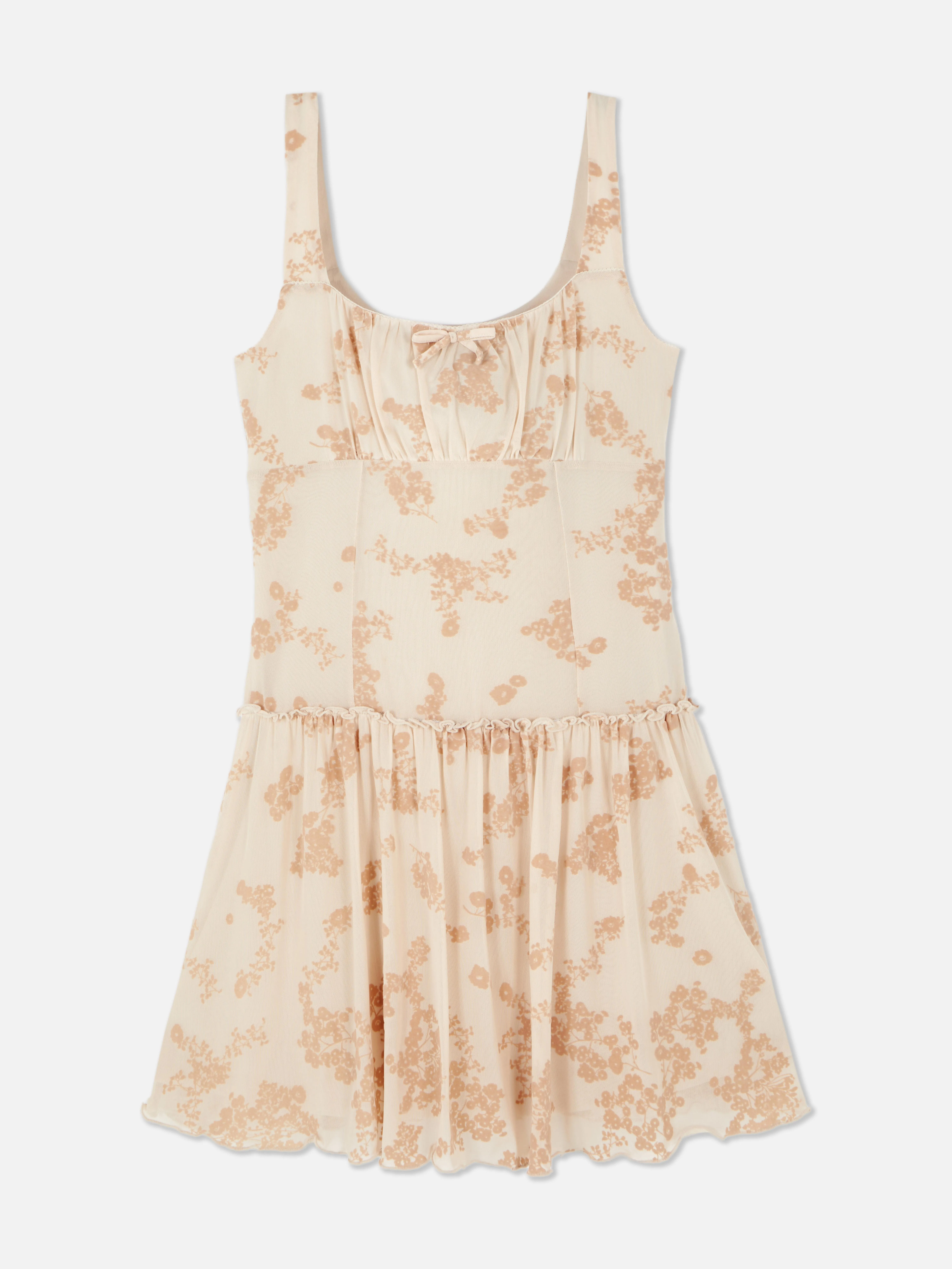 Vestido corto de malla con diseño devoré de Rita Ora