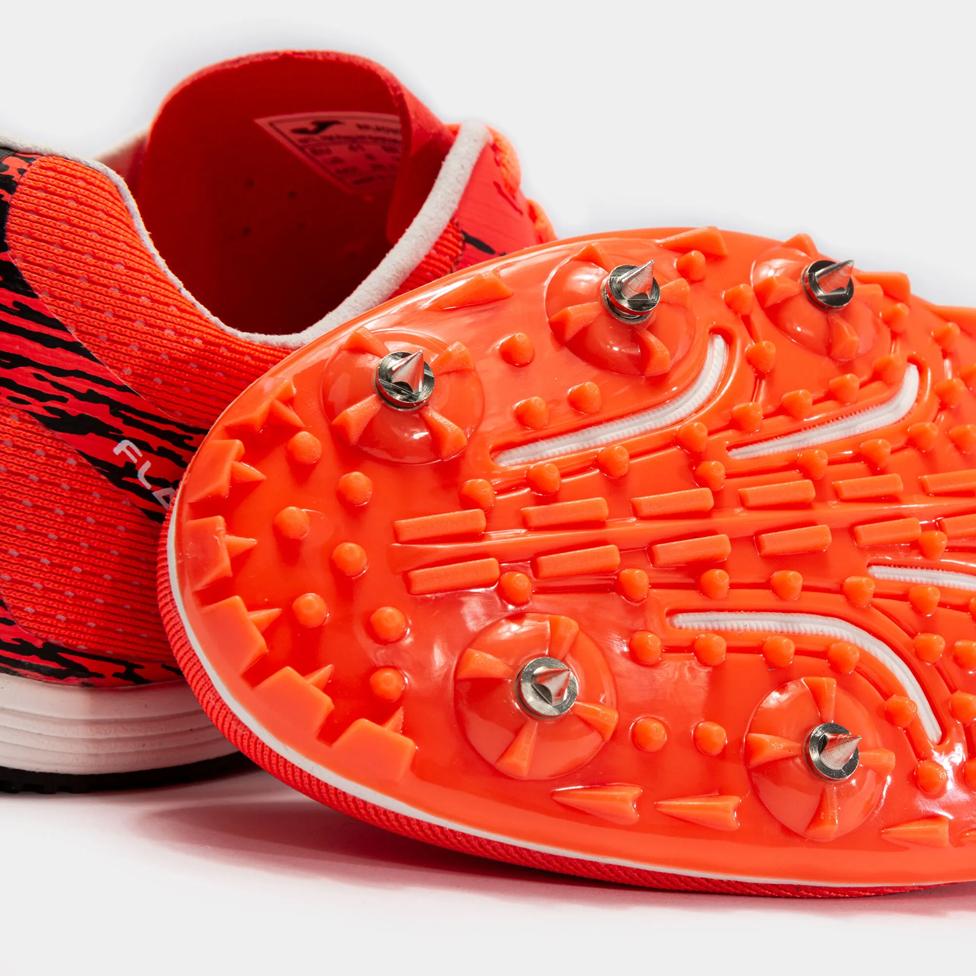 Zapatillas running Flad 21 clavos unisex coral